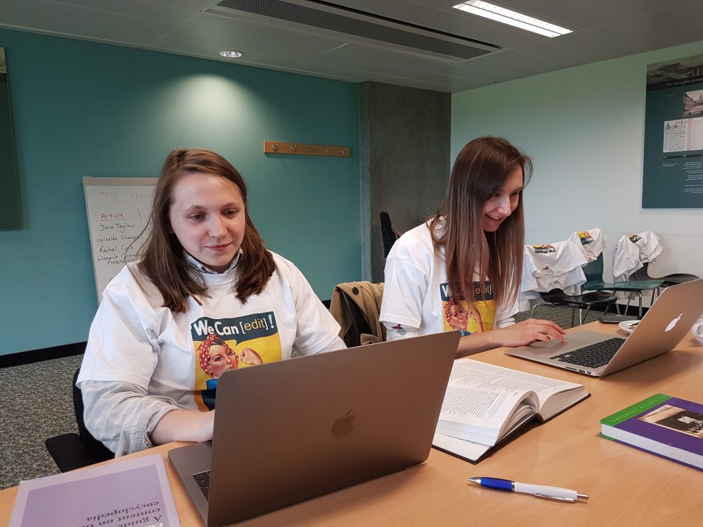 Students at laptops creating Wikipedia pages about Scottish suffragettes at Processions 2018
